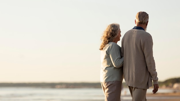 Free photo medium shot couple walking together