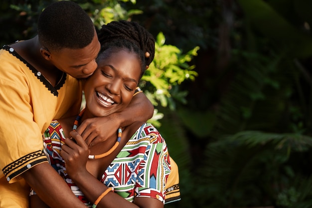 Free photo medium shot couple wearing native attire