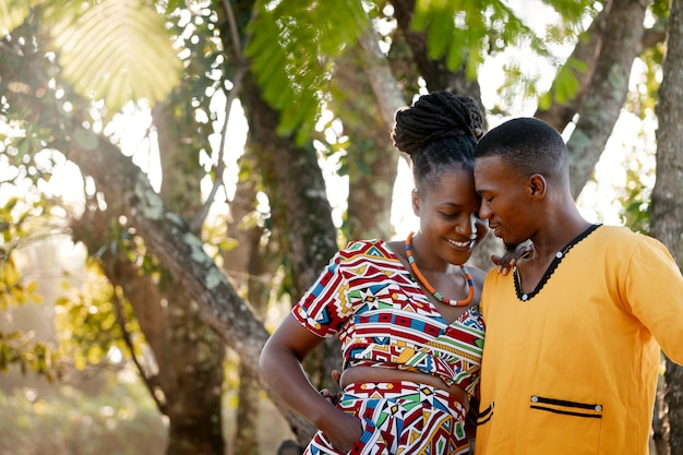 Free photo medium shot couple wearing native attire