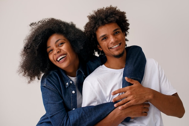 Medium shot couple with afro hairstyles