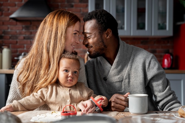 Medium shot couple with baby