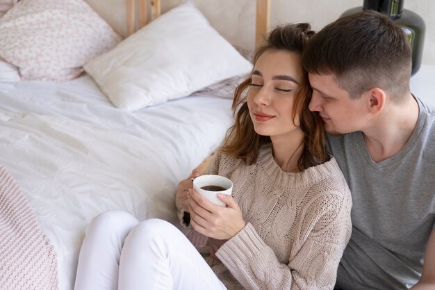 Medium shot couple with coffee