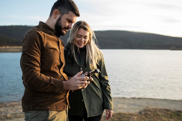 Free Photo medium shot couple with drone remote