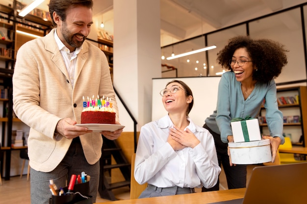 Medium shot coworkers celebrating at office