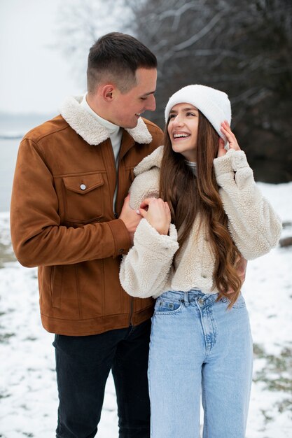 Medium shot cute couple outdoors