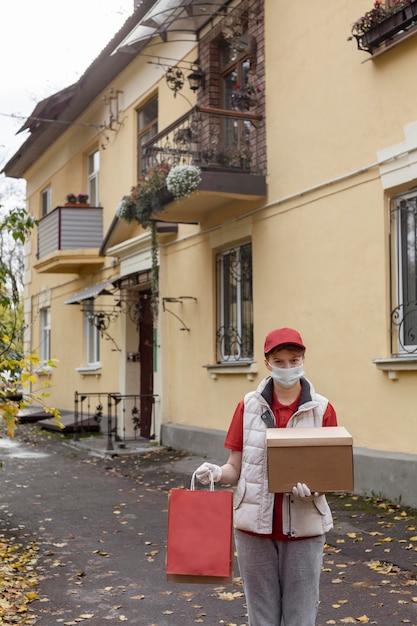 Free photo medium shot delivery guys holding box