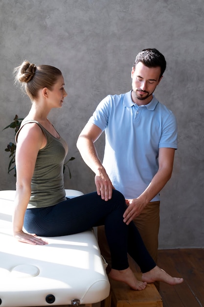 Medium shot doctor checking patient