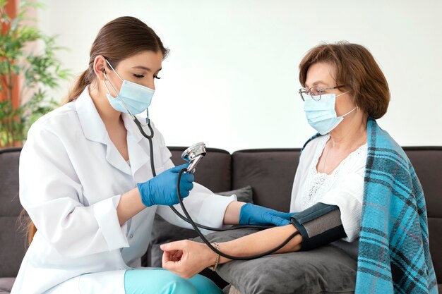 Medium shot doctor checking woman