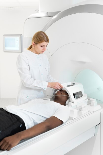 Medium shot doctor giving ct scan to patient