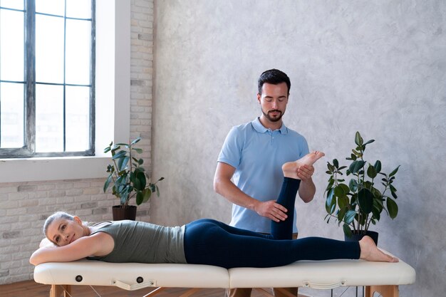 Medium shot doctor helping patient