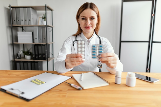 Medium shot doctor holding medicine