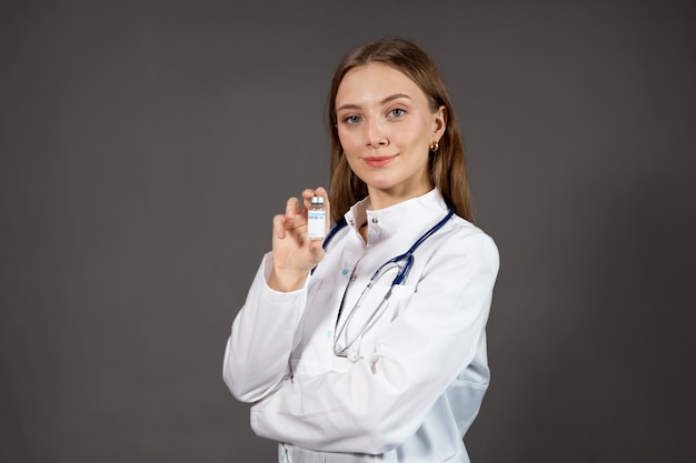 Medium shot doctor holding vial