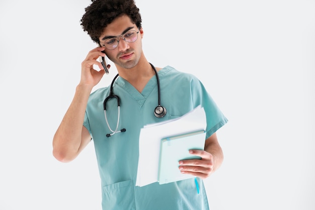 Medium shot doctor talking on phone