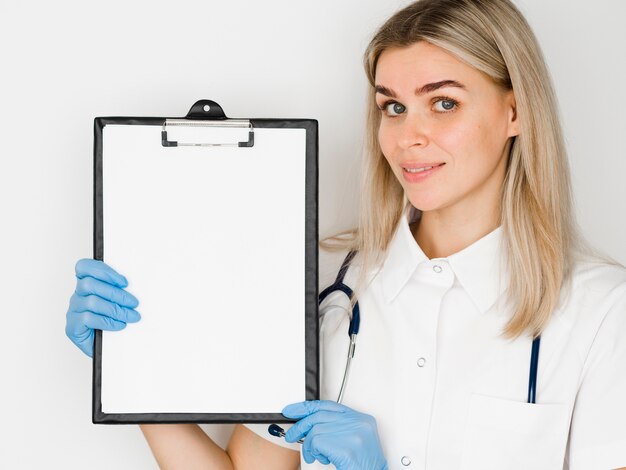 Medium shot doctor with clipboard