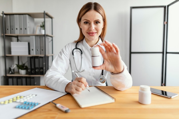 Medium shot doctor at work with medicine