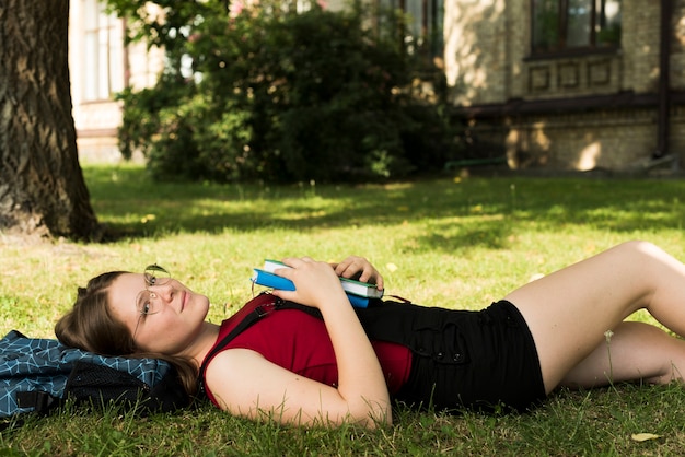 Free photo medium shot of dreamy school girl laying