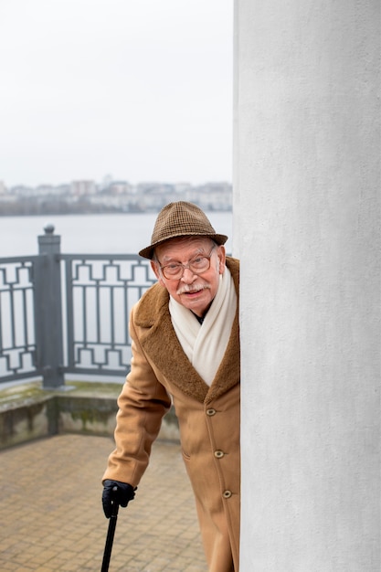 Free Photo medium shot elderly man taking a stroll