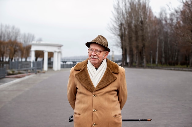 Free Photo medium shot elderly man taking a stroll