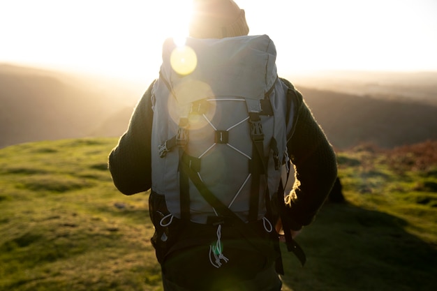 Medium shot explorer carrying backpack