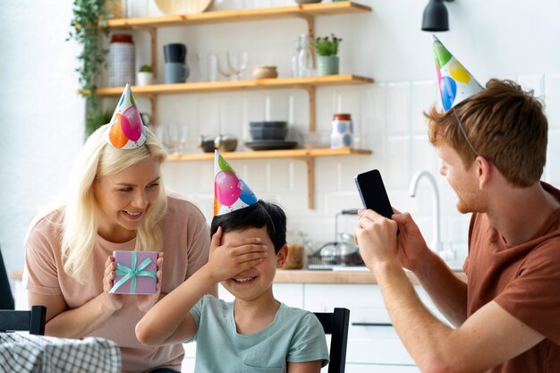 Medium shot family celebrating birthday