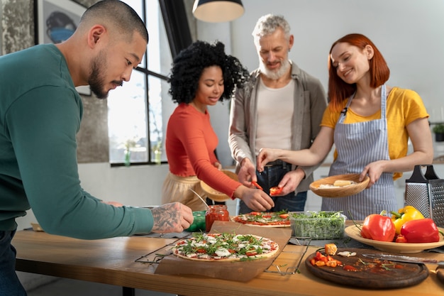 Medium shot family cooking delicious pizza