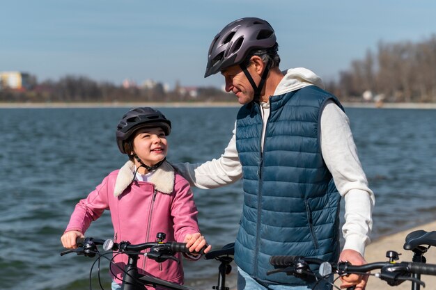 Medium shot family cycling together