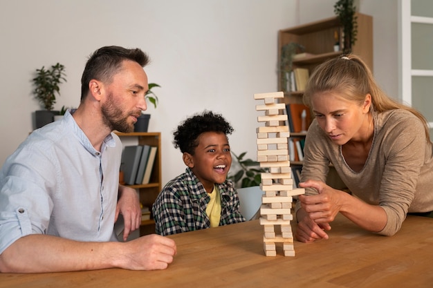 Medium shot family members playing game