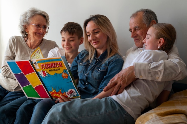 Medium shot family reading comics together