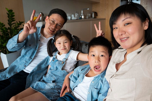 Medium shot family taking selfie