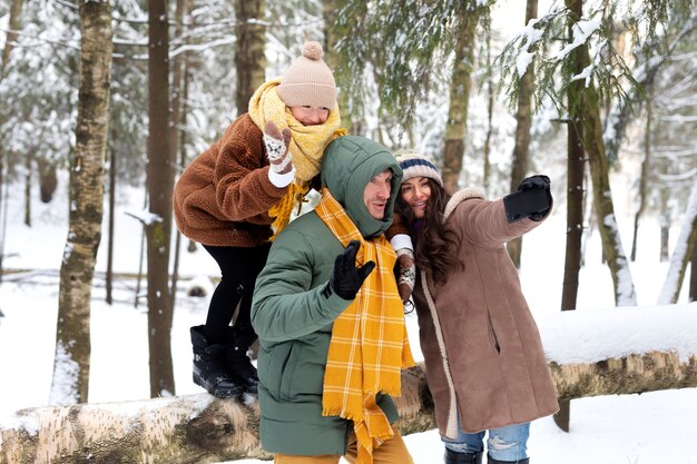 Medium shot family taking selfie