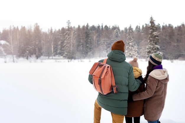 Medium shot family during winter