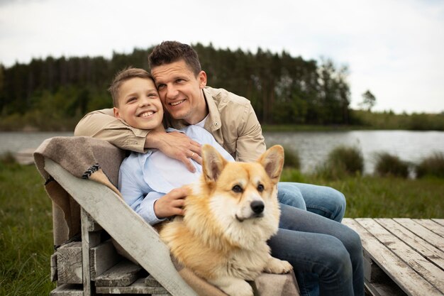 Medium shot father and kid with dog