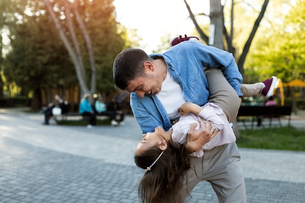 Medium shot father playing with girl