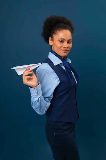 Free photo medium shot female flight attendant in studio