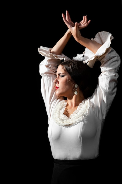 Free Photo medium shot of flamenca with hands crossed