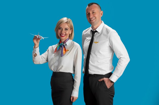 Free photo medium shot  flight attendants posing together