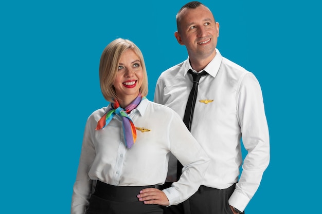 Free photo medium shot  flight attendants posing together