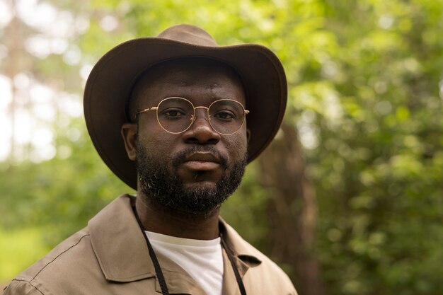 Medium shot forest warden wearing hat