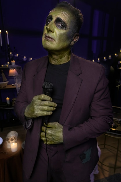 Free photo medium shot frankenstein holding microphone