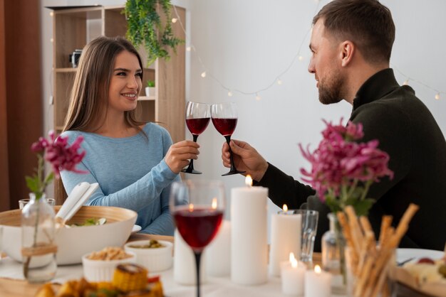 Medium shot friends at dinner party