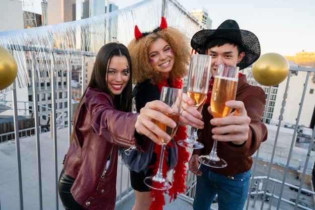 Medium shot friends holding drinks