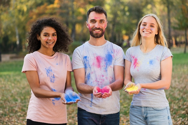 Medium shot of friends posing for holi