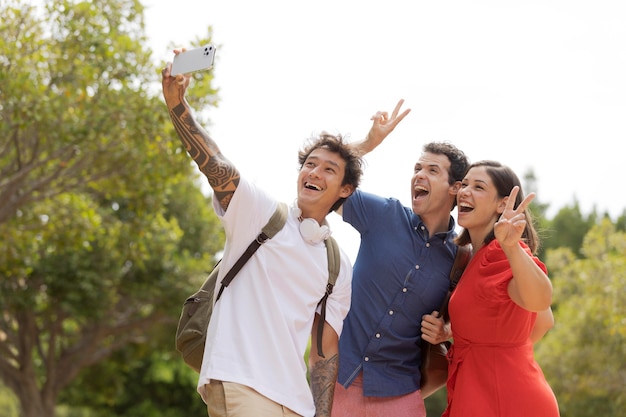 Medium shot friends taking selfie