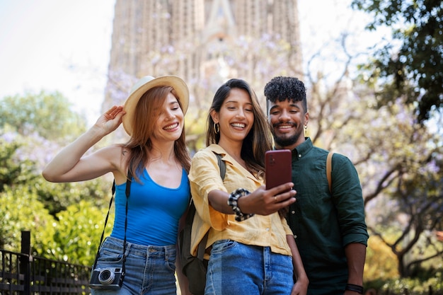 Medium shot friends taking selfie