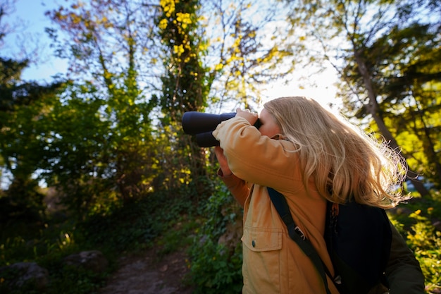 Free photo medium shot girl exploring nature