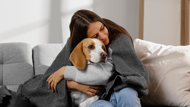 Medium shot girl hugging dog