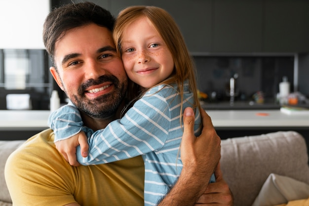 Medium shot girl hugging father