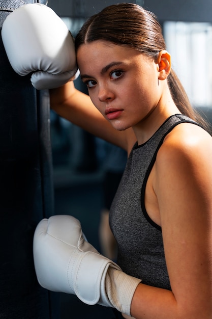 Free Photo medium shot girl learning boxing