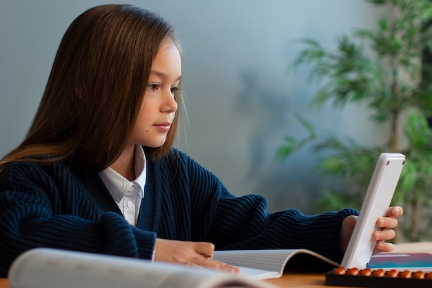 Medium shot girl learning math at school