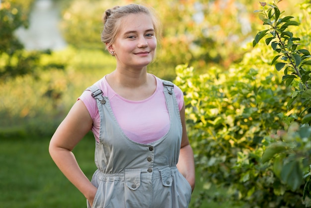 Medium shot girl posing outdoors